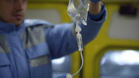 Sequence of Paramedics Doing Intravenous Therapy in Ambulance Stock Footage 123690572