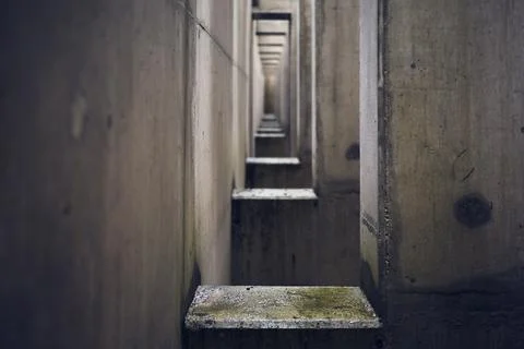 Sequence of rectangular holes inside each other in an old rusty building Foto stock