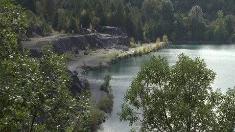 Sequence of shot of an abandoned rock quarry Stock Footage 75247666