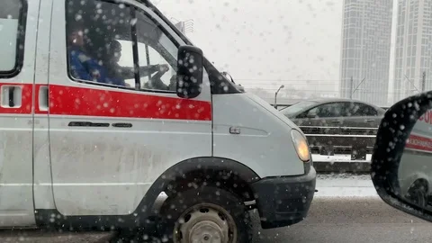 Sequence shots of ambulance car ride among traffic by third transport ring Stock Footage 102235346