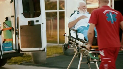 Sequence of shots of team of paramedics transporting old patient Stock Footage 211819903