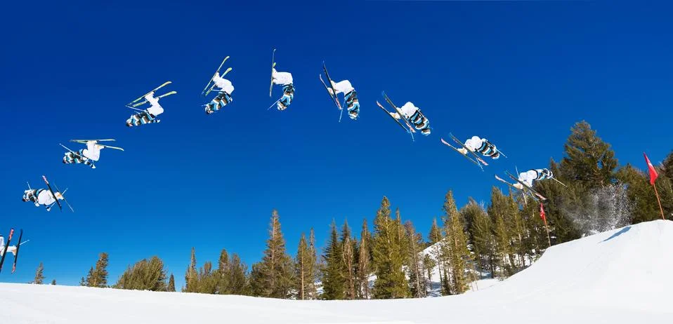 Sequence of skier doing radical back flip off jump Stock Photos