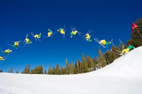 Sequence of skier doing radical back flip off jump Stock Photos