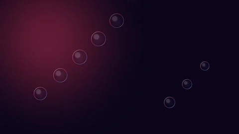 A sequence of translucent soap bubbles floating against a dark red gradient Stock Footage 338311371