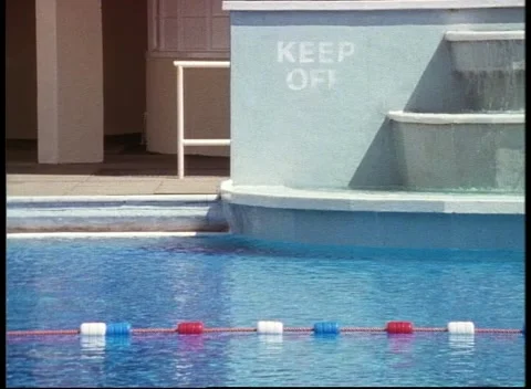 Sequence of water park area with no people around and pools with diving boards Stock Footage 159723757