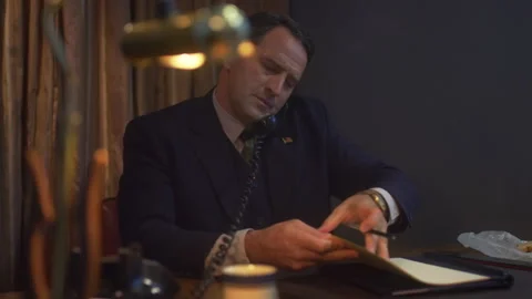 Sequences of a businessman working in office, 1950s, USA - Reenactment Stock Footage 245290564