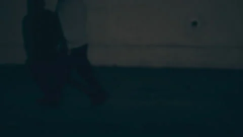 Sequences of a man in a hoodie walking down a dark alley at night, USA - Reenact 動画素材 237696036