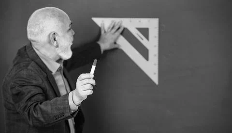 Sequential subject. Mathematics at board. favorite subject. senior man teacher Stock Photos