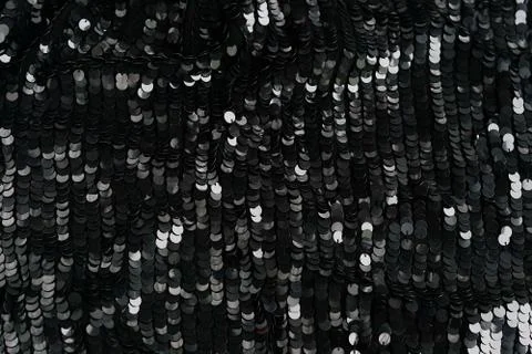 Sequin fabric texture background. Black color fabric, festive background Stock Photos