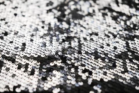 Sequin fabric texture. Shiny silver sparkling background. Clothing piece of Stock Photos