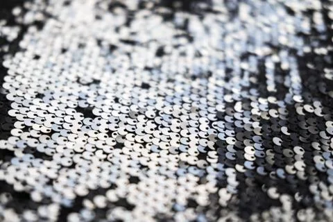 Sequin fabric texture. Shiny silver sparkling background. Clothing piece of Stock Photos