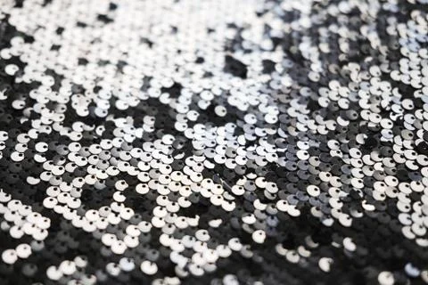 Sequin fabric texture. Shiny silver sparkling background. Clothing piece of Stock Photos