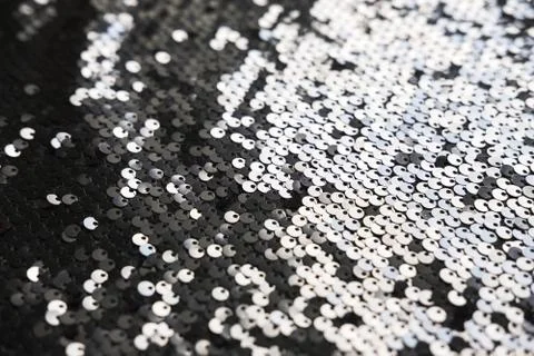 Sequin fabric texture. Shiny silver sparkling background. Clothing piece of Stock Photos