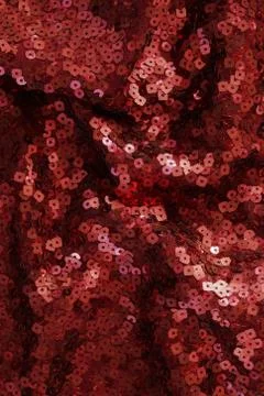 Sequin texture background. Red  color fabric. Christmas, festive backgrou Stock Photos