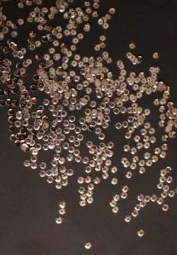 Sequins on black paper Stock Photos