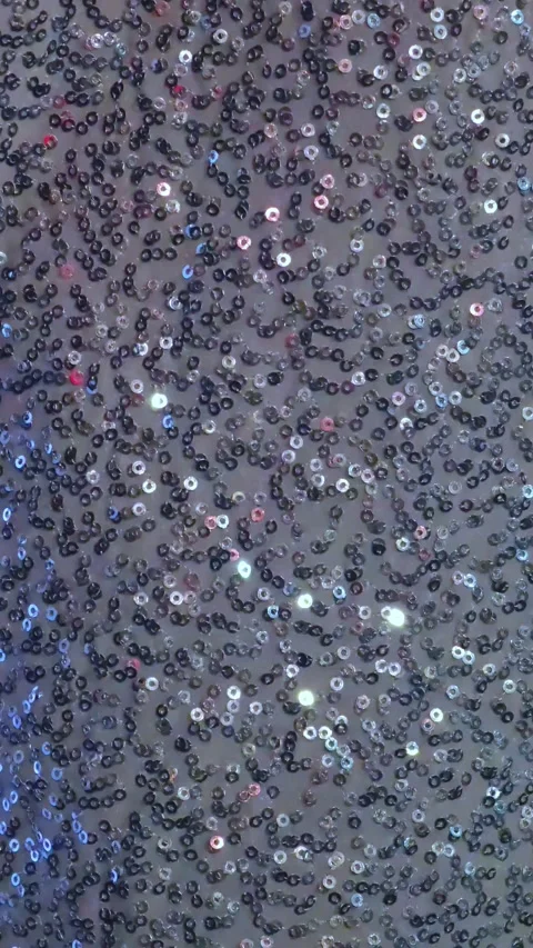 Sequins close-up. Abstract background with sequins colorful on the fabric. Stock Footage 297834803