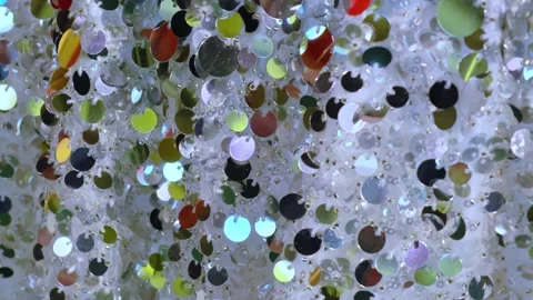 Sequins close-up. Abstract background with sequins colorful on the fabric. 스톡 동영상 299791927
