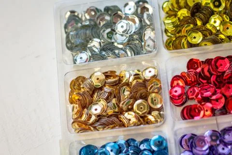 Sequins for decor. Material for decorating clothes and needlework. Stock Photos