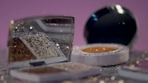 Sequins fall on cosmetics. Stock Footage 77512234