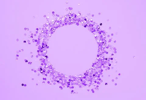 Sequins lilac confetti lined in round frame purple very peri background Stock Photos