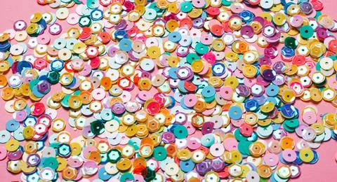 Sequins multicolored confetti, Soft selective focus close-up . Abstract festive Stock Photos