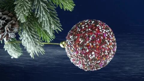 Sequins of snow fall on a pink ball on a Christmas tree on a blue background Stock Footage 230987934