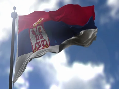 Serbia Flag is Waving Against Blue Sky Stock Footage