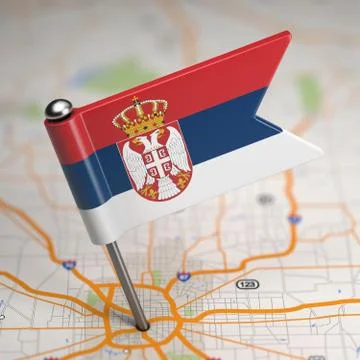Serbia Small Flag on a Map Background. Illustrazione stock