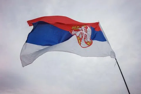 The Serbian flag is flying Foto stock