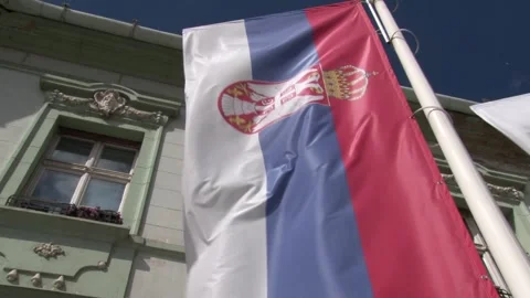 Serbian flag on pole, wind weather, day Stock Footage 327973468