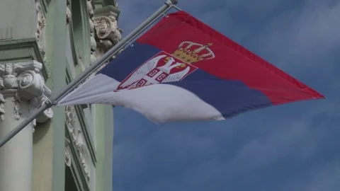 Serbian flag on pole, wind weather, day Video stock 327973493