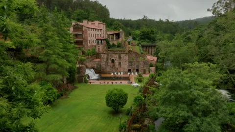 Serene aerial perspective of an elegant, rustic stone estate nestled Stockbeeldmateriaal 336286977