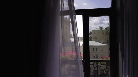 A Serene and Beautiful View Through the Window with Sheer Curtains Vidéo 294385909