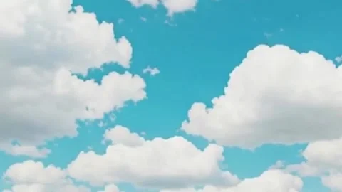 A serene and bright blue sky filled with fluffy, Stock Footage 340318311