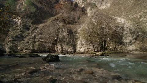 A Serene and Idyllic Riverbed featuring Smooth Pebbles Video stock 302213141