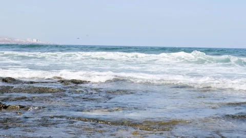 The Serene and Tranquil Ocean Waves are Crashing on Rocky Shoreline Video stock 317006841