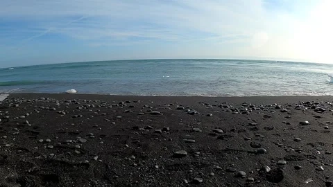 Serene Atlantic waves crashing on black volcanic sand beach in Iceland Stock Footage 334053553