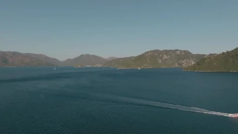 Serene Bay with a Speedboat at Sunset Stock Footage 282931057