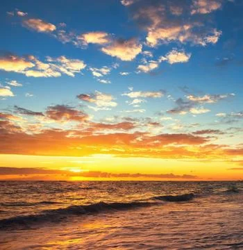 A serene beach landscape at sunset Stock Photos