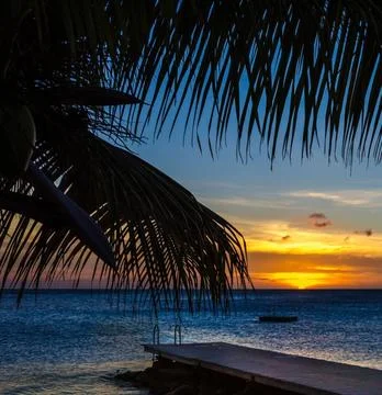 A serene beach landscape at sunset Stock Photos