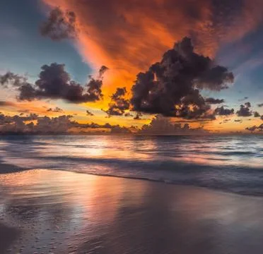 A serene beach landscape at sunset Stock Photos