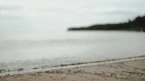 A Serene Beach Scene featuring Gentle Waves, Soft Sands, and a Beautiful Horizon Video stock 309866744