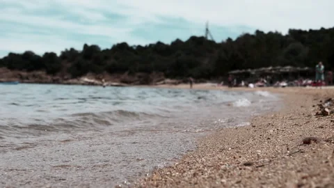 A Serene Beach Scene featuring Gentle Waves, Soft Sand, and a Beautiful Horizon Stock Footage 313873088