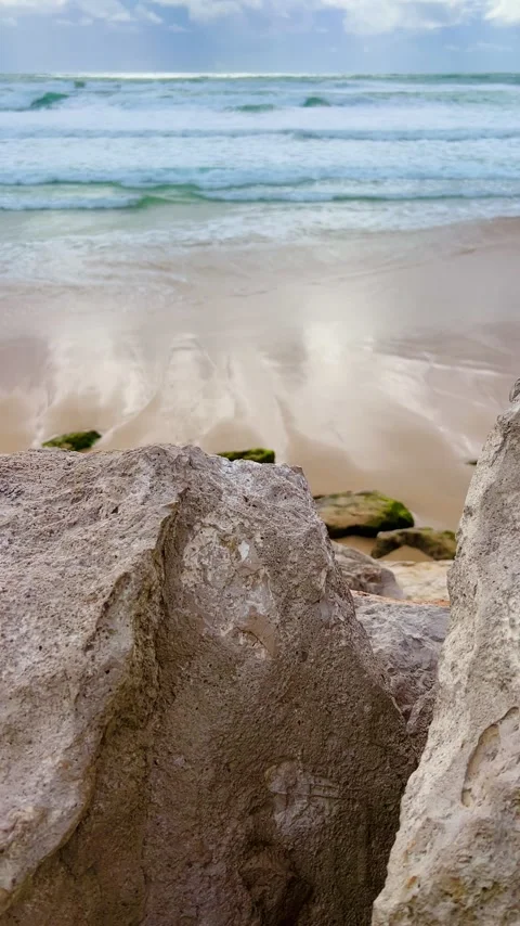 Serene Beach Scene with Waves and Clear Blue Sky Stock Footage 274388689