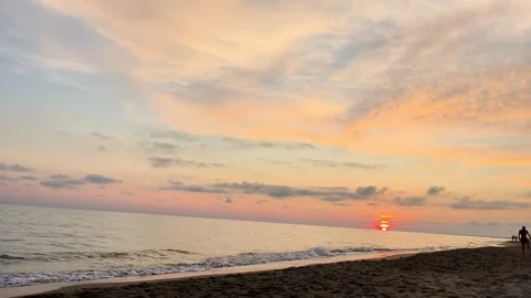 Serene Beach Sunset with Calm Waves and Colorful Sky Stock Footage 340602701
