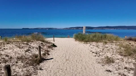Serene Beach with Tranquil Clear Waters and Sand in Bueu Stockbeeldmateriaal 305410192