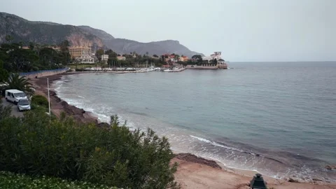 A serene beach with a van by the ocean highlights adventure Stock Footage 301282902