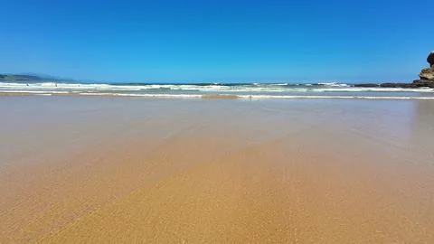 A Serene Beach View Featuring Tranquil Calm Waves and a Beautiful Clear Blu.. Foto stock