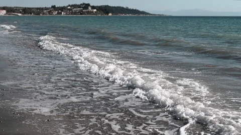 Serene beach waves capture the essence of coastal tranquility and stunning Stock Footage 313871308