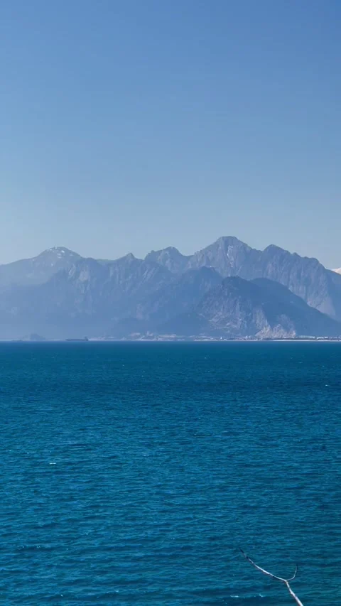 Serene Blue Ocean With Mountain View Stock Footage 304883154